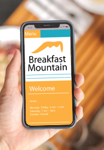 Layout image of the Breakfast Mountain website on a phone